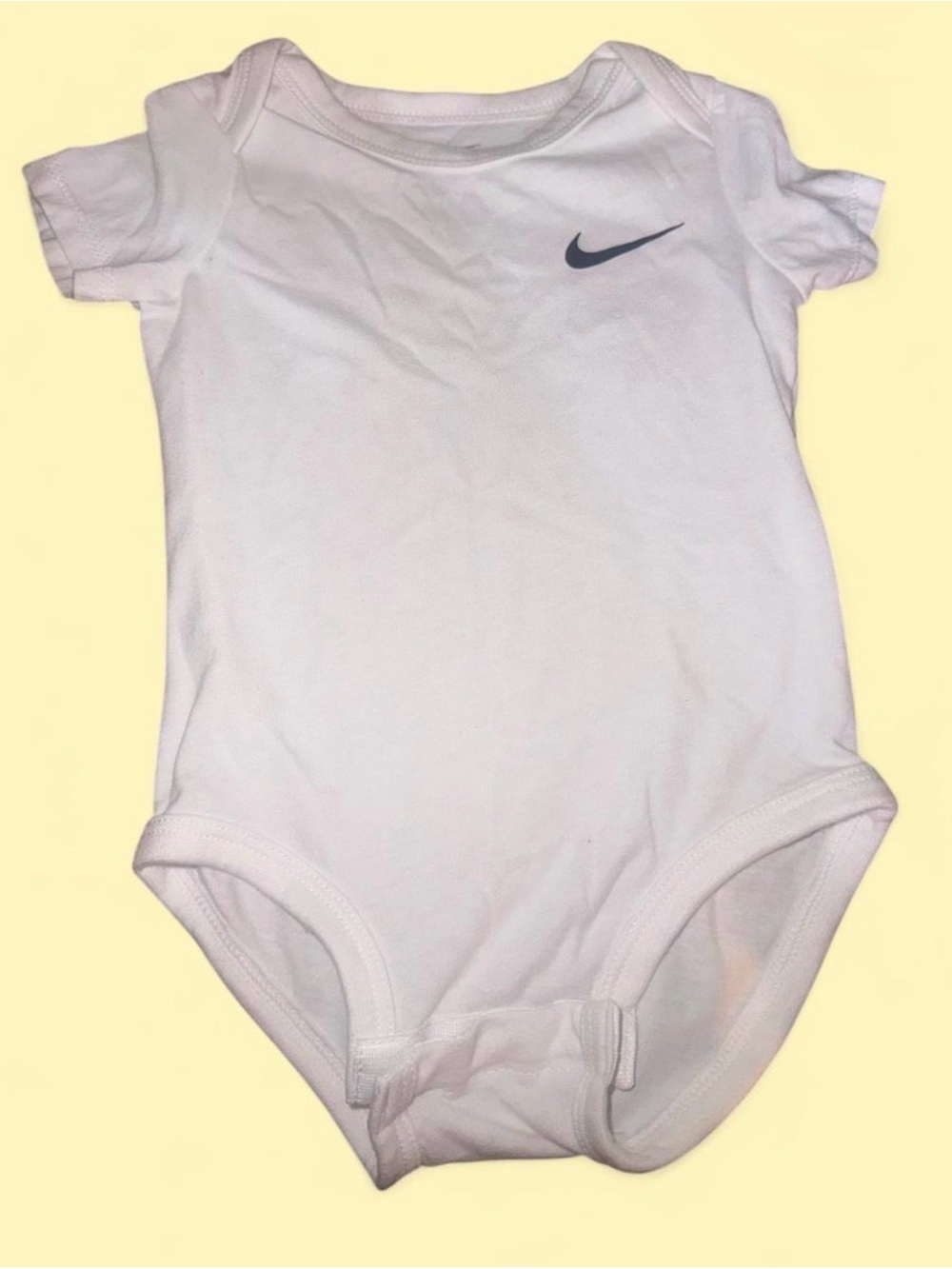Nike White Baby Bodysuit with Navy Swoosh